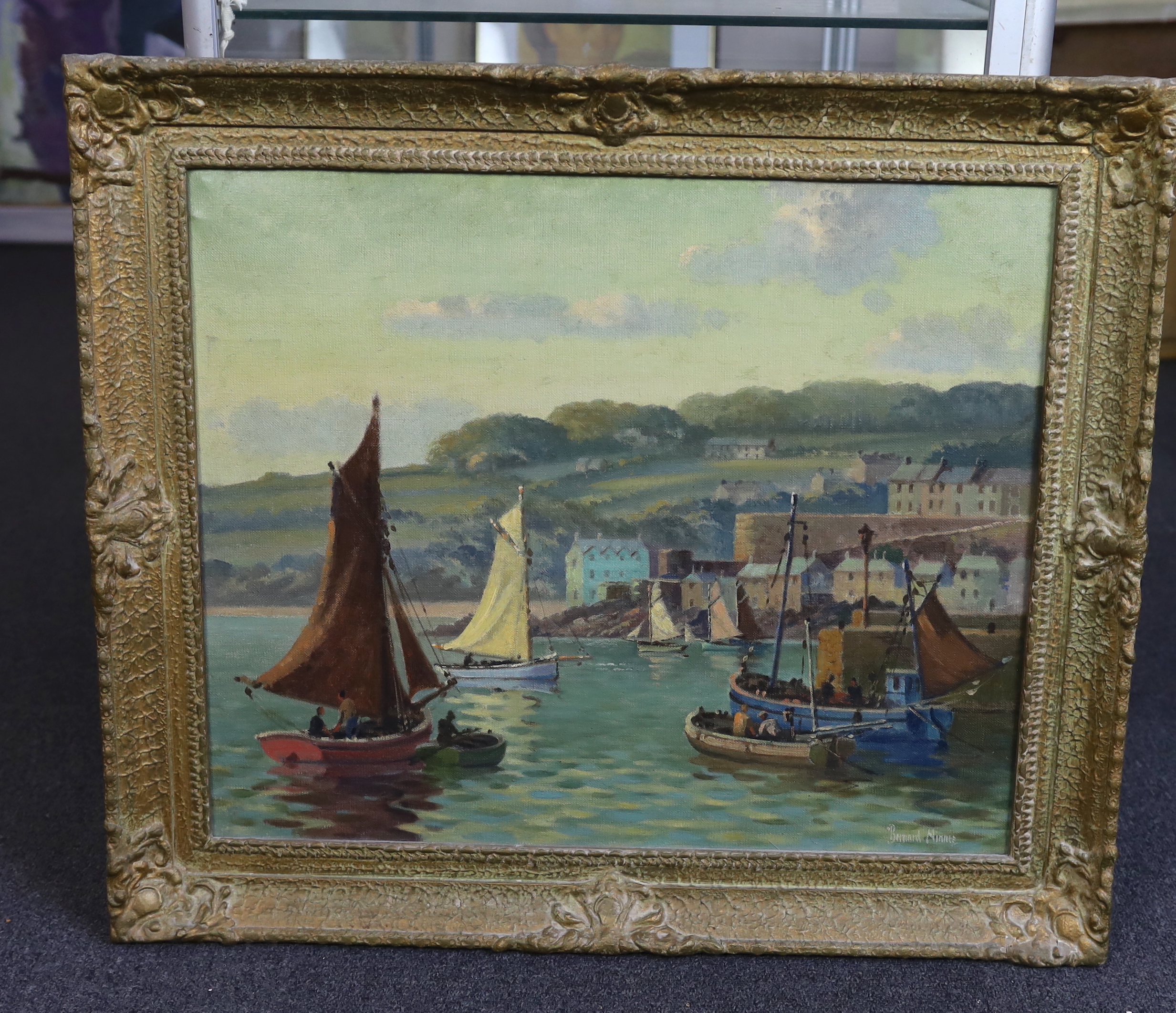 Bernard Ninnes (English, 1899-1971), Fishing boats in a Cornish harbour, oil on canvas, 50 x 60cm